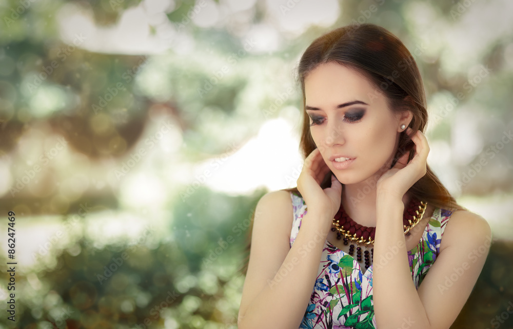 Fototapeta premium Stylish Woman Wearing Floral Dress and Big Necklace