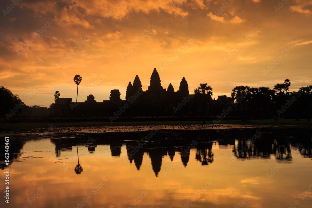 Ancient temple Angkor Wat from across the lake. The largest religious monument in the world. Siem Reap, Cambodia
