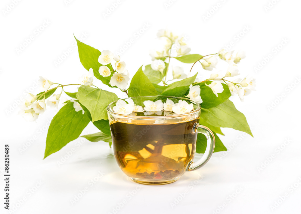 isolated transparent cup of tea with jasmine flowers. isolated transparent cup of tea with jasmine flowers.