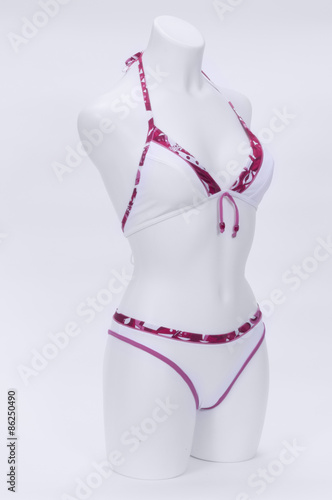 Mannequin, wearing a bikini, on white background photo