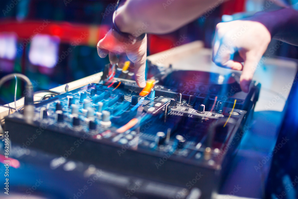 DJ mixing music on console DJ mixing music on console