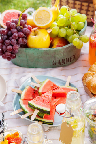 Fresh healthy tropical fruit on a picnic blanket