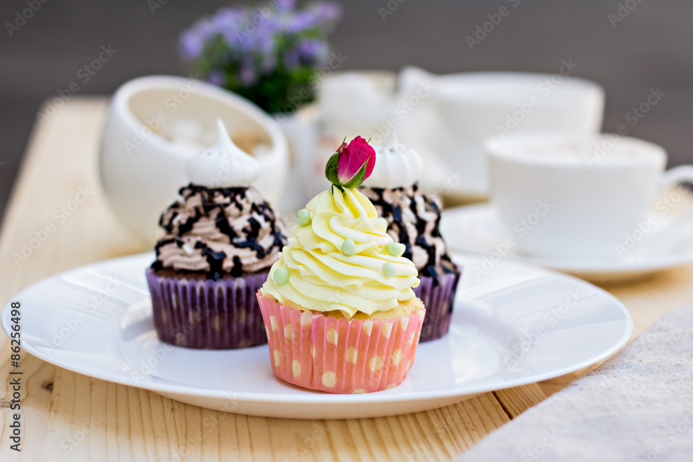 Chocolate Cupcake with chocolate frosting on the table Chocolate Cupcake with chocolate frosting on the table