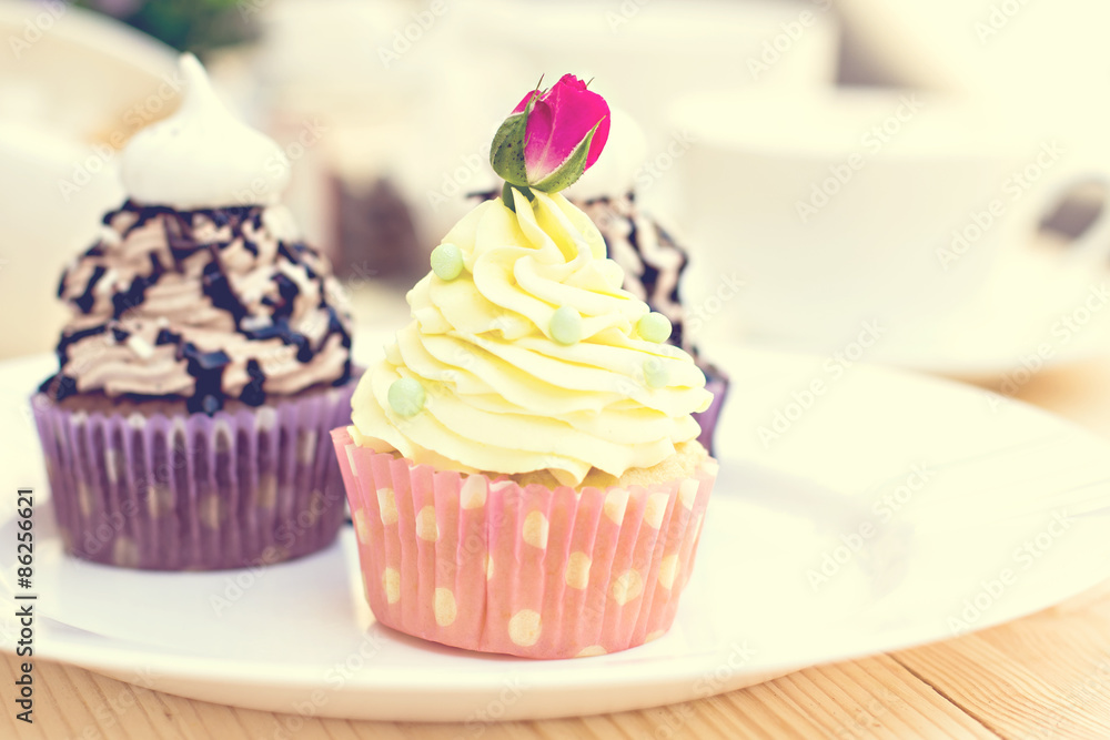 Chocolate Cupcake with chocolate frosting on the table Chocolate Cupcake with chocolate frosting on the table