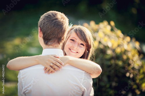 girl tenderly embraces her boyfriend © serbogachuk