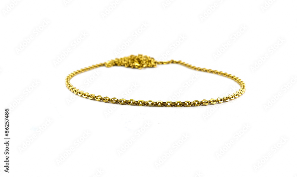 Gold chain jewely focusing at the front and blurred in depth isolated on white background Gold chain jewely focusing at the front and blurred in depth isolated on white background