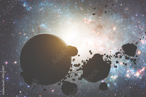 Fototapeta Naklejka Na Ścianę i Meble -  Asteroids and planets on a starry background. 