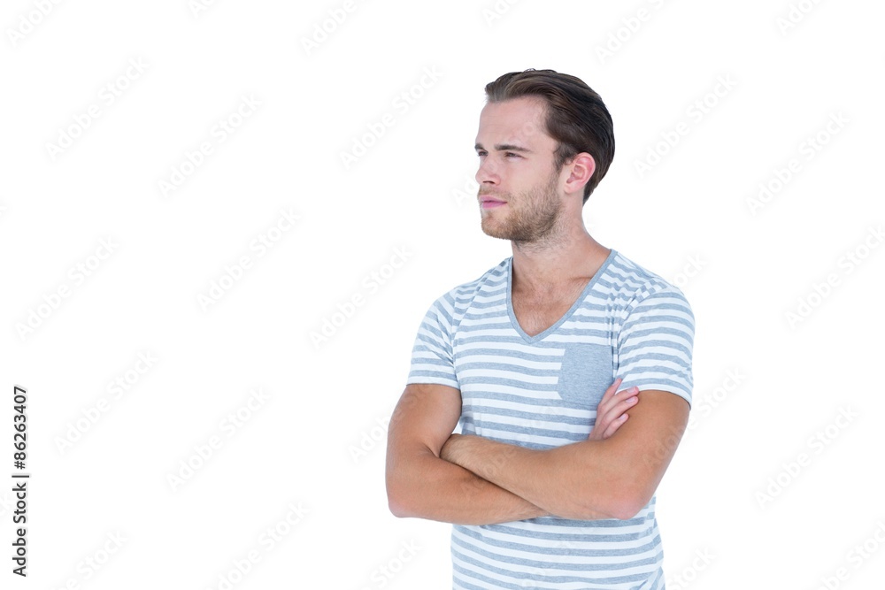 Handsome man looking away with arms crossed Handsome man looking away with arms crossed