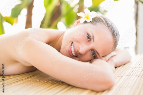 Peaceful blonde lying on massage table 