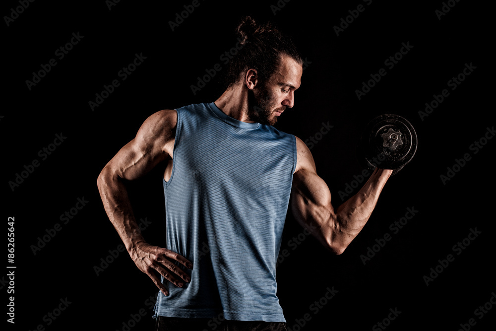 Closeup of a handsome power athletic man bodybuilder doing exerc
