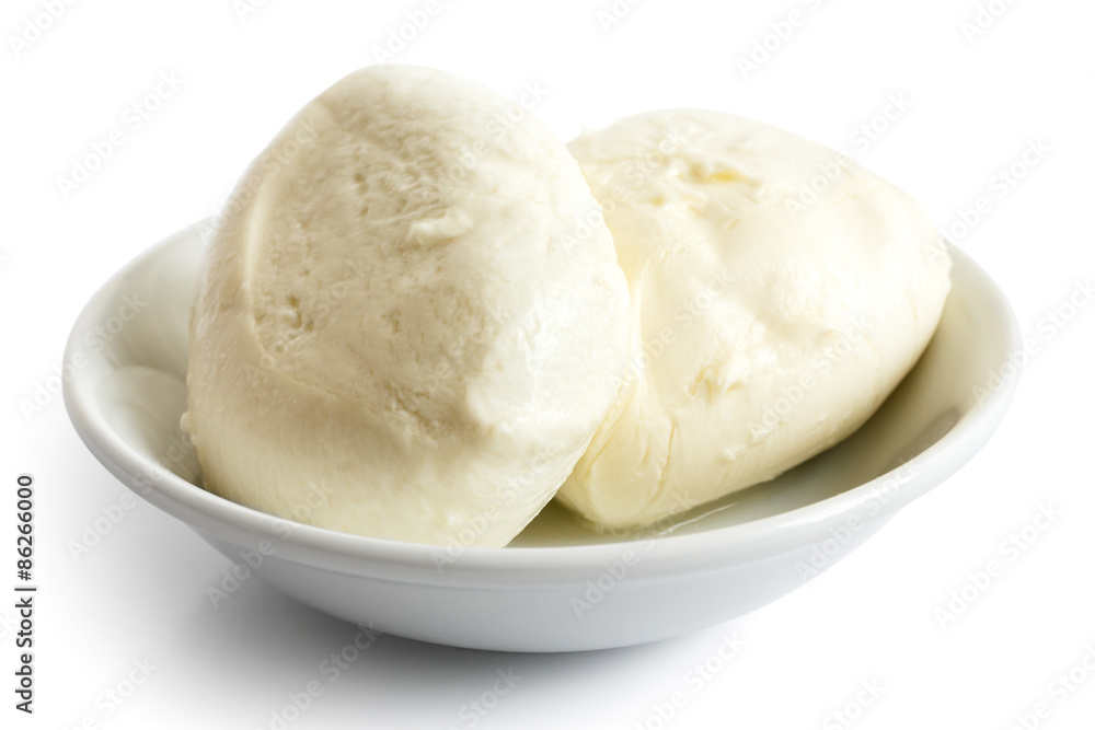 Two balls of mozzarella cheese in a dish, isolated on white.