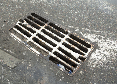 Drain grate on the road