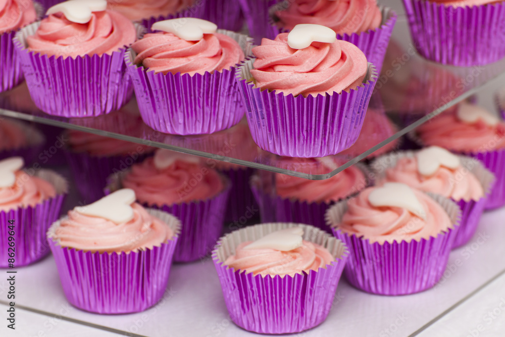 Pink cupcakes on stand