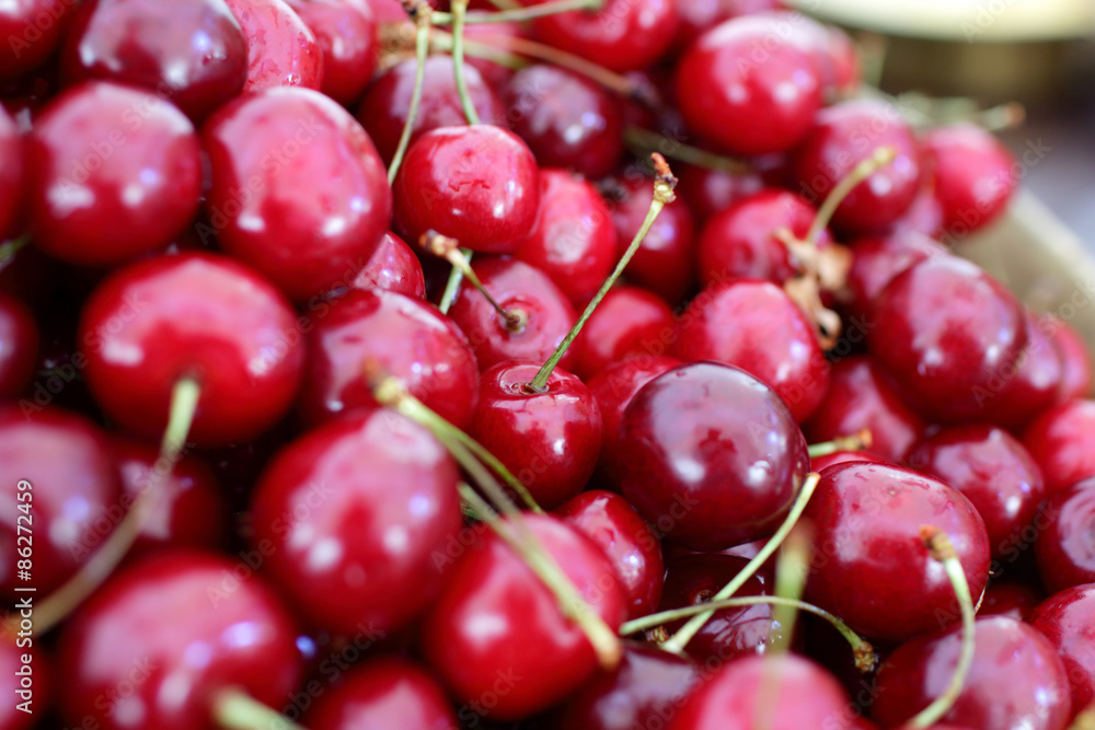 dish with fresh cherries closeup