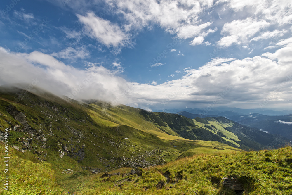 Beautiful landscape with blue cloudy sky in Rodnei mountains, Romania