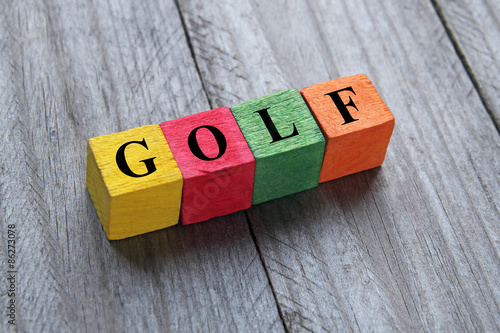 word golf on colorful wooden cubes photo