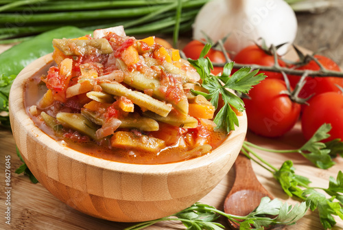 Traditional Caucasian Georgian lobio of green beans with vegetab photo