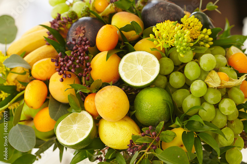 Fruit basket close-up  bananas  apples  grapes  apricots  melon 