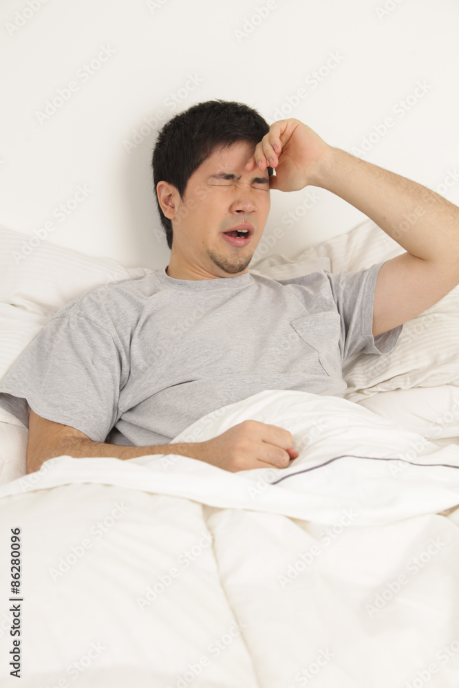 Man lying with headache Man lying with headache