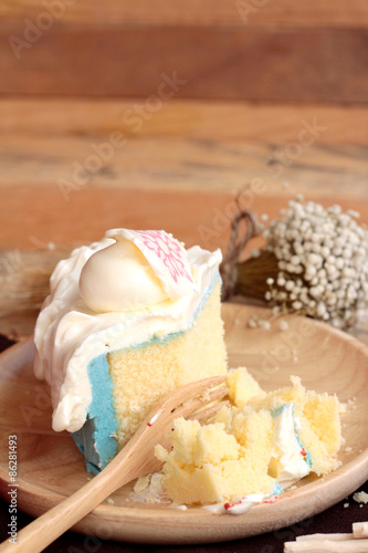 White cream cake delicious on wood background