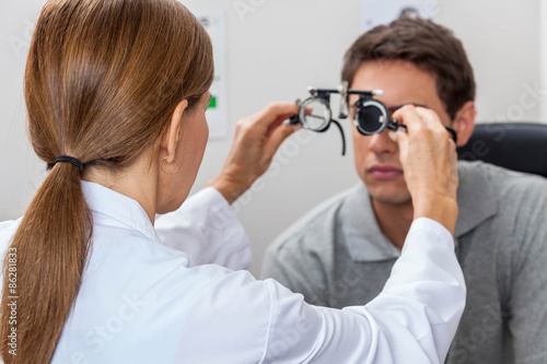 Doctor putting special lenses photo