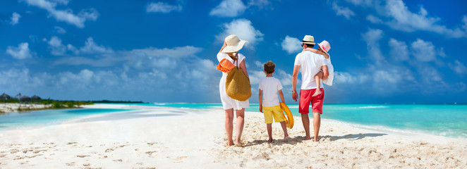 Family with kids on beach vacation