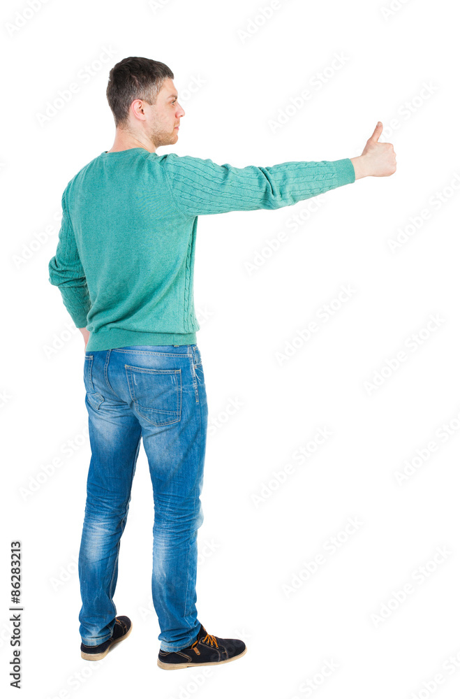 Back view of man in shirt shows thumbs up. Back view of man in shirt shows thumbs up.