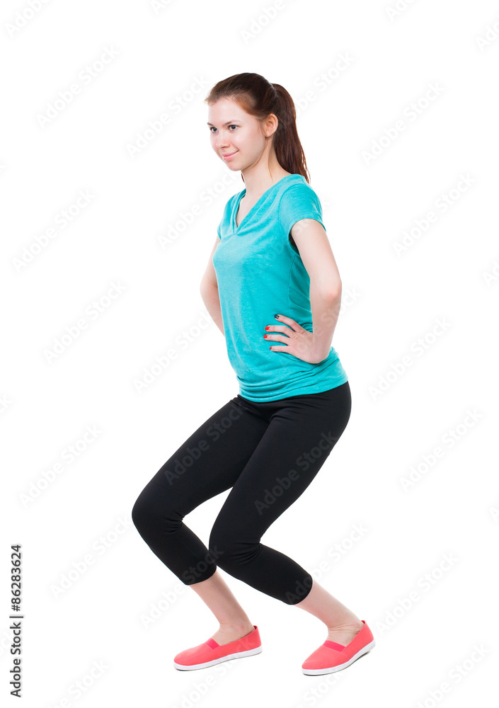 back view of standing young beautiful woman in sport dress inv back view of standing young beautiful woman in sport dress inv