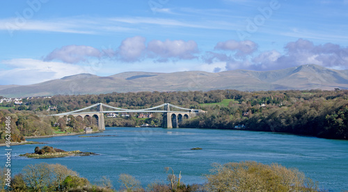 The Menai Suspension Bridge near Bangor, North Wales connects the Welsh mainland to the Isle of Anglesey.  photo