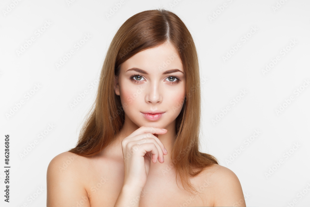 Young beautiful brunette woman with natural makeup on grey backg Young beautiful brunette woman with natural makeup on grey backg