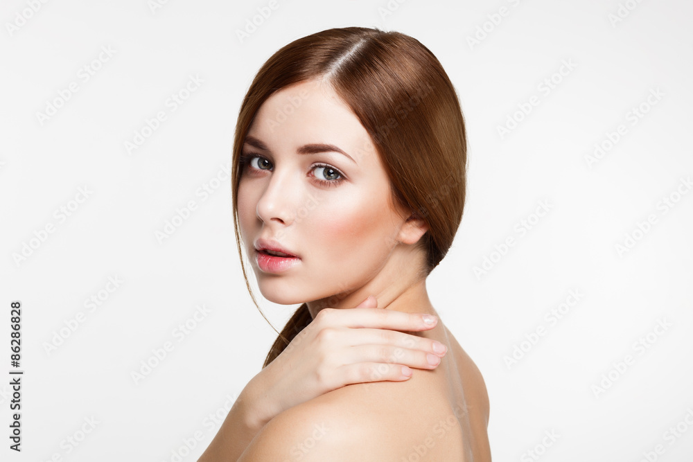 Young beautiful brunette woman with natural makeup on grey backg Young beautiful brunette woman with natural makeup on grey backg