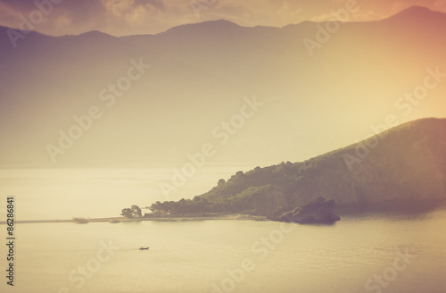Silhouette of of Sveti Nikola island at sunrise in the Adriatic sea.