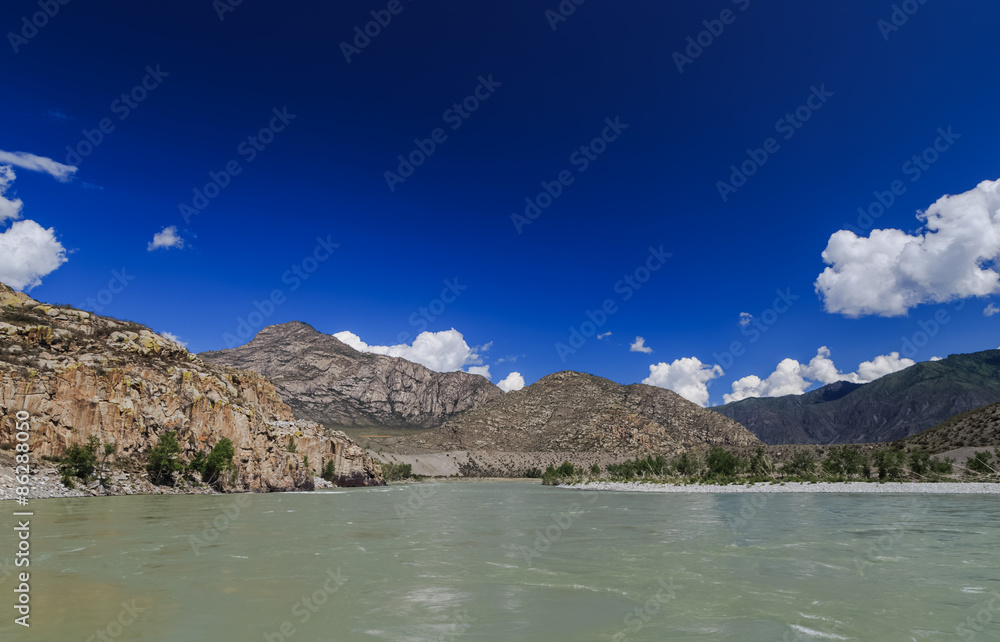 coast mountain river with views of the mountains and clouds