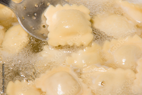 the dumplings cooks in a pan with the boiling water