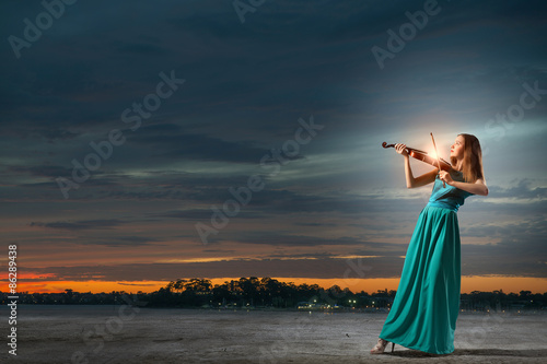 Elegant violinist player photo