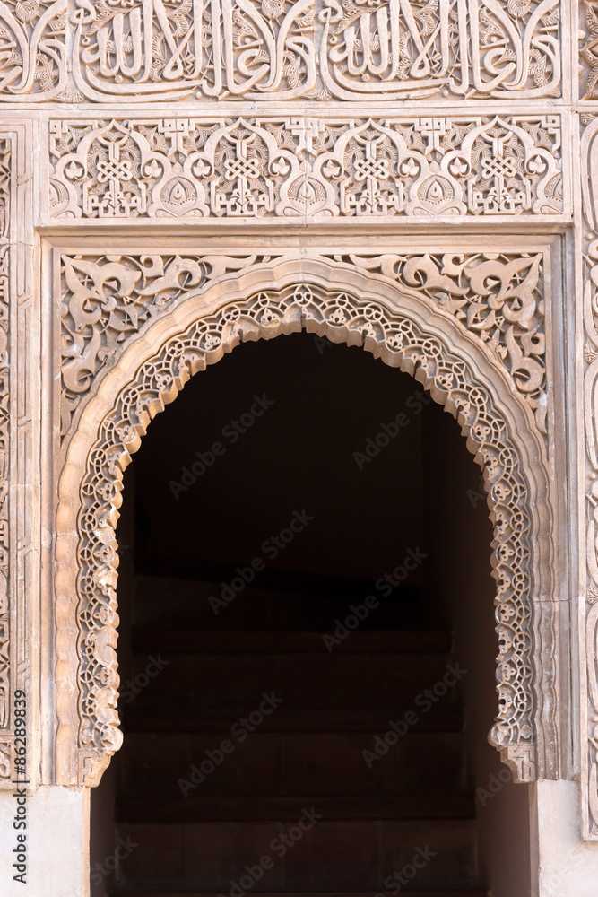 Moorish arch with Arabian script in Alhambra, Granada, Spain