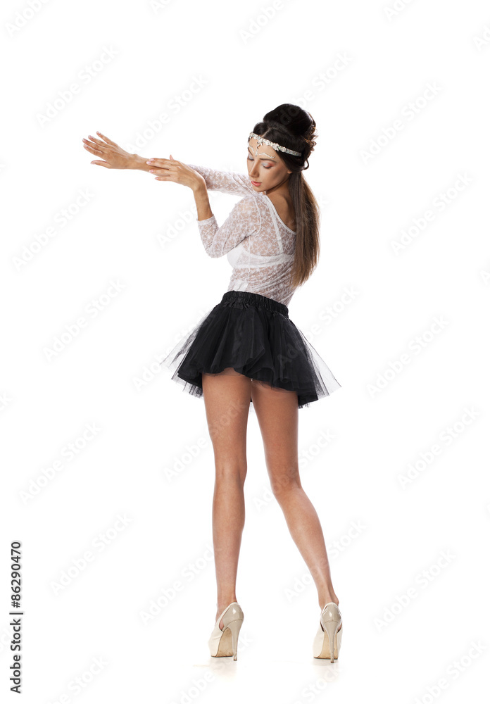 Naklejka premium Portrait of a beautiful slim model in black skirt and white blou