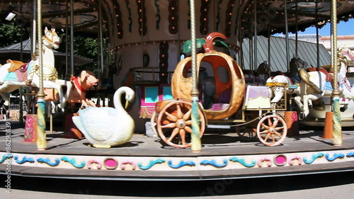 Old wooden carousel in Arles, France photo