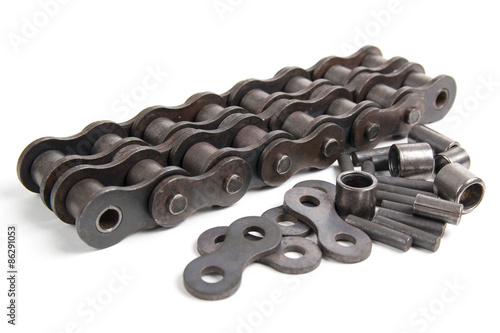 Roller chain and metallic elements isolated on a white background photo