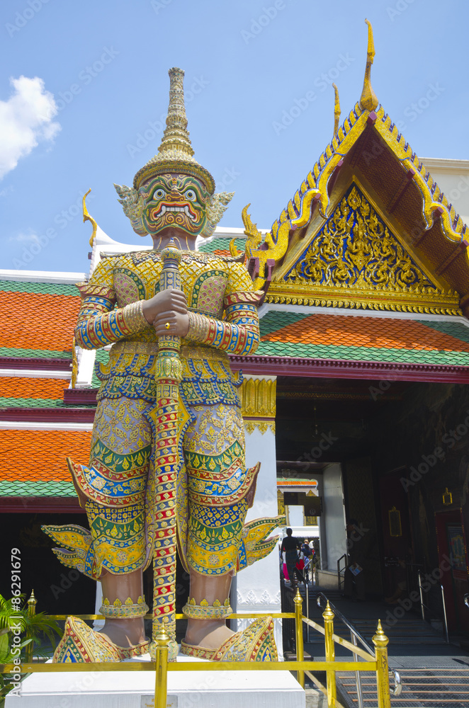 Giant golden statue at Emerald Buddha Temple, Bangkok, Thailand Giant golden statue at Emerald Buddha Temple, Bangkok, Thailand