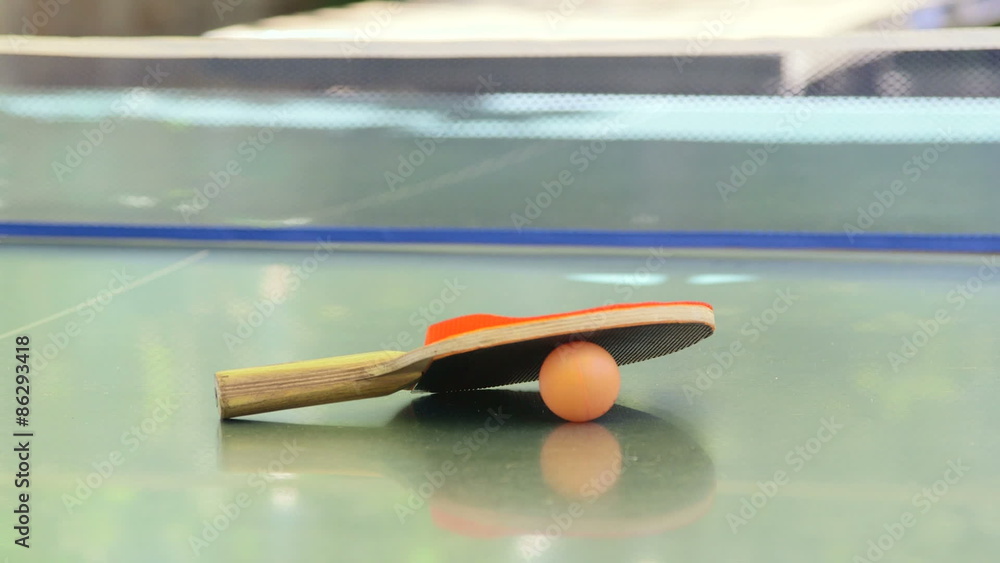 Ping pong racket with a ball on the tennis table outdoor close-up Ping pong racket with a ball on the tennis table outdoor close-up