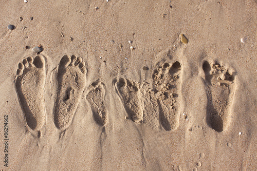 Family footprints on the sand beach in Side, Turkey