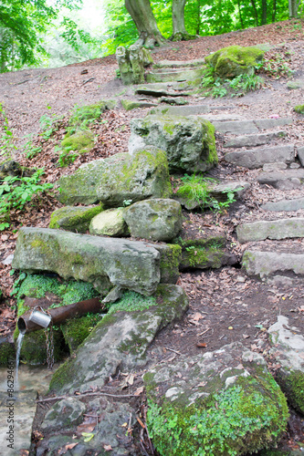 Stepping forest stones and small waterfall. photo