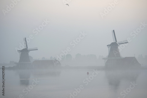 windmills in morning fog the Netherlands, Zaanse Schans