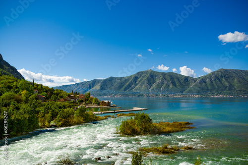 Harbour and mountain river at Boka Kotor bay (Boka Kotorska), Montenegro, Europe.
