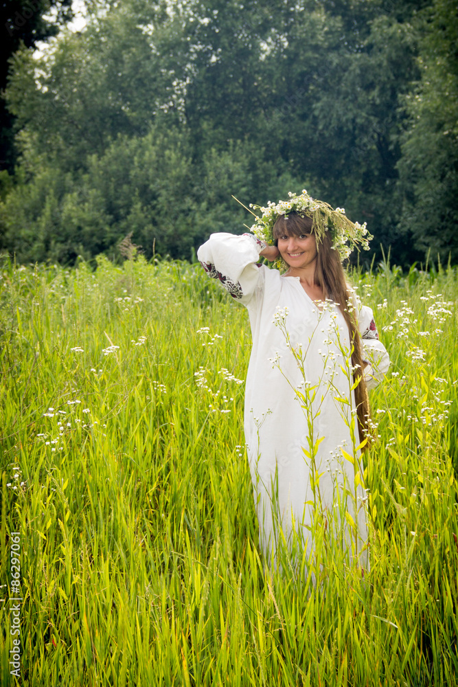 young girl in the Ukrainian embroidered shirt, with a wreath of young girl in the Ukrainian embroidered shirt, with a wreath of