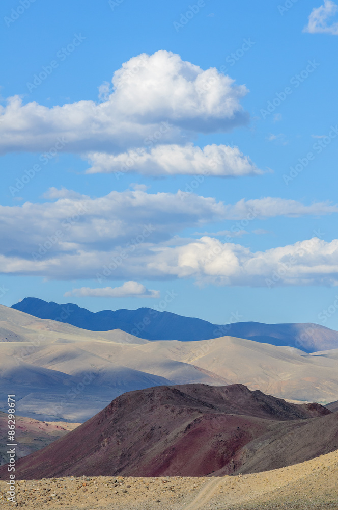 Highland landscape with blue shadows and clouds in Altai in summer