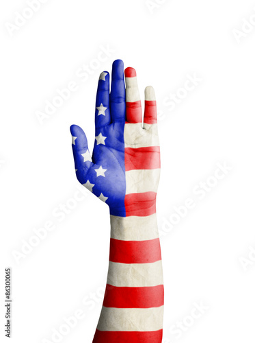 Hand of young man raised with United States of America flag patt