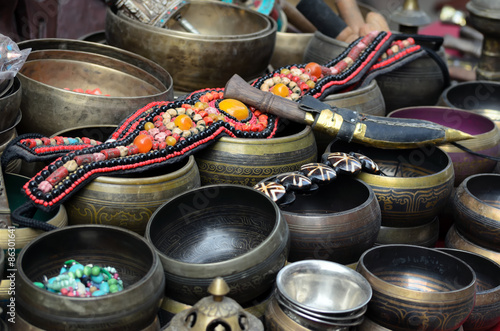 Traditional bracelet made of stones on top of metal bows and dagger   photo