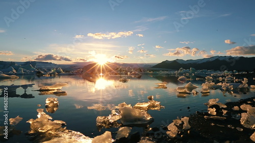 Vibrant Sunset over Iceberg Glacier Lagoon. Global Warming Concept. Jokulsarlon, Iceland.